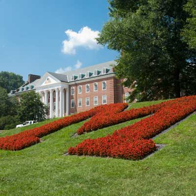 Maryland M with Symons Hall in the background