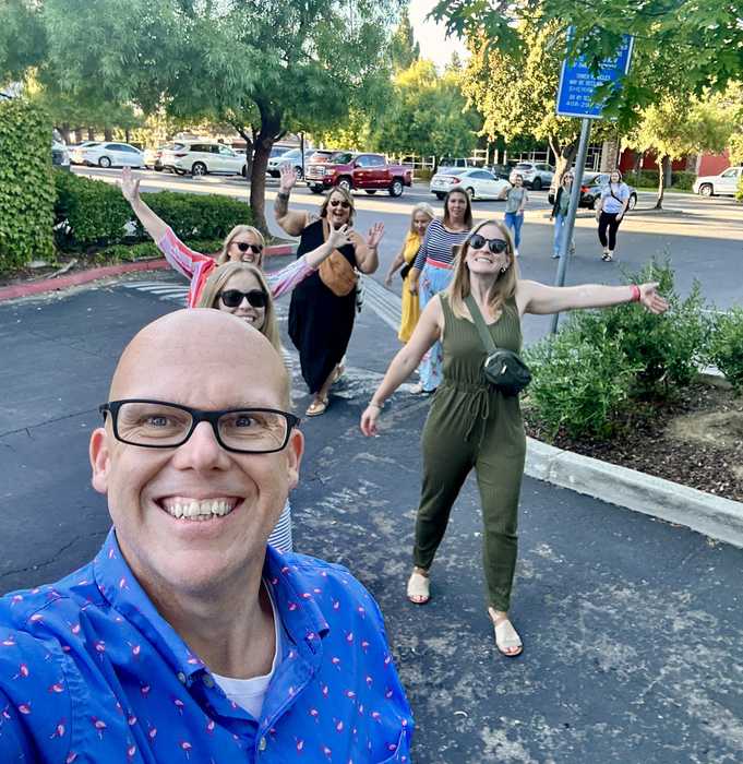 Group of Apple Learning Academy participants walking across a parking lot toward 1 Infinite Loop in Cupertino, CA.