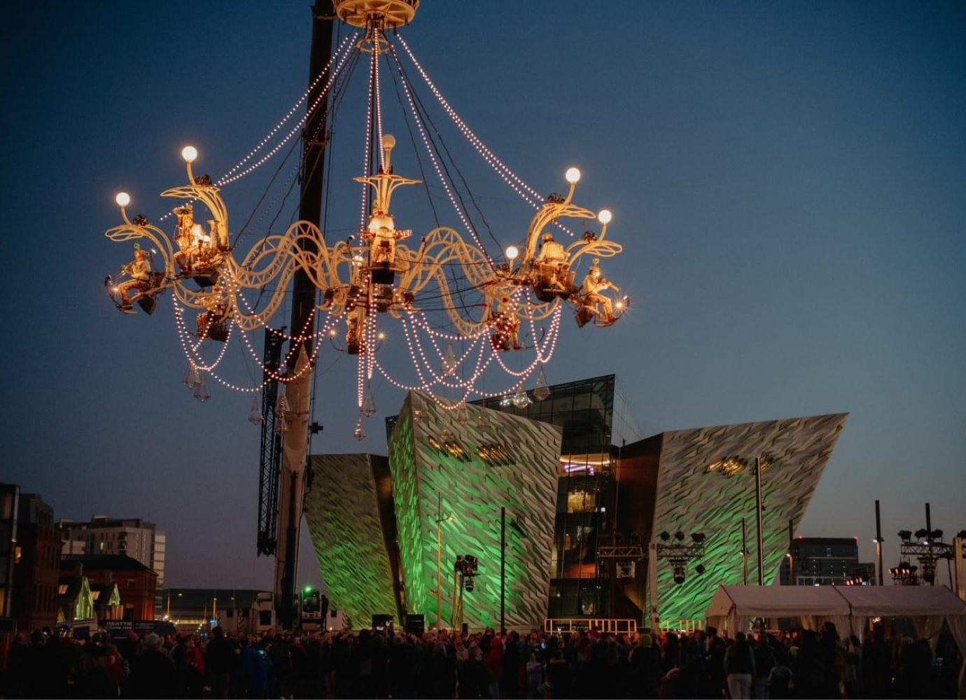 Aerial performance on giant chandelier type structure, in front of Titanic Belfast visitor centre