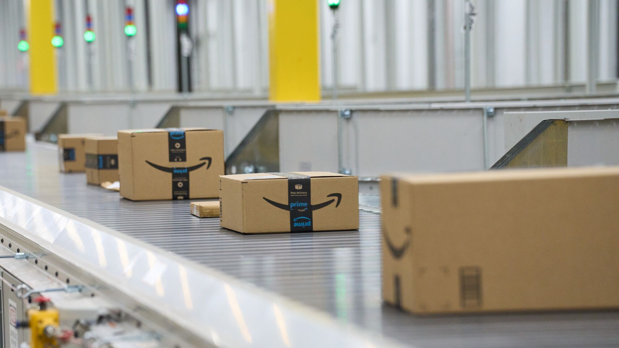 An image of Amazon boxes traveling in a fulfillment center. 