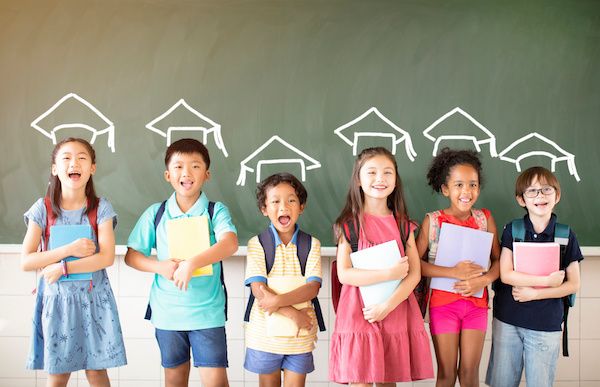 Group of diverse young students standing together in classroom