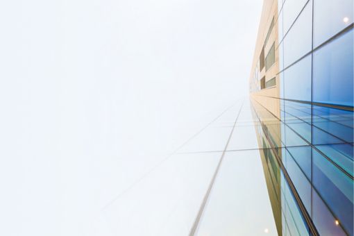 blue glass building view from bottom