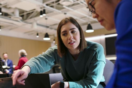 Woman explaining something to colleague