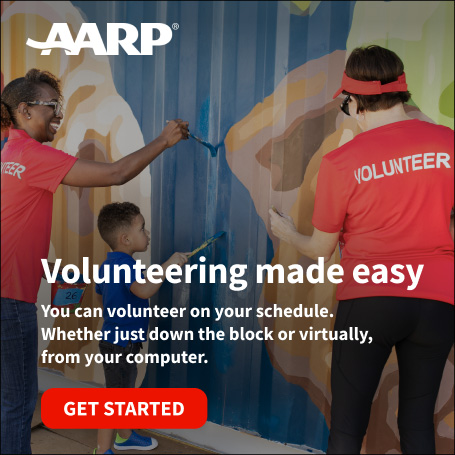 Photo of volunteers painting a community mural