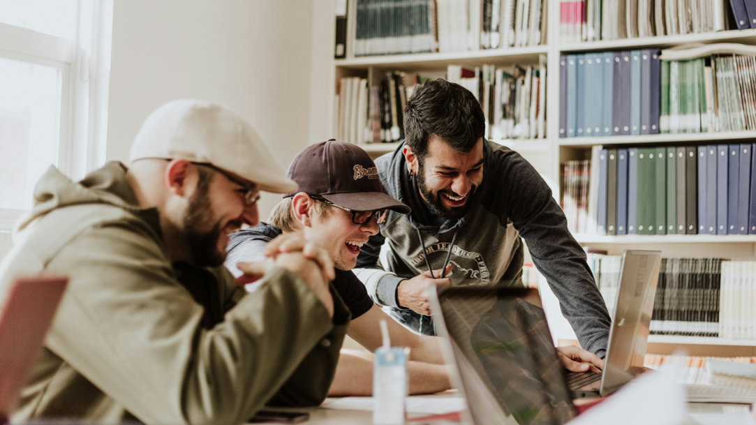 College students studying and laughing together