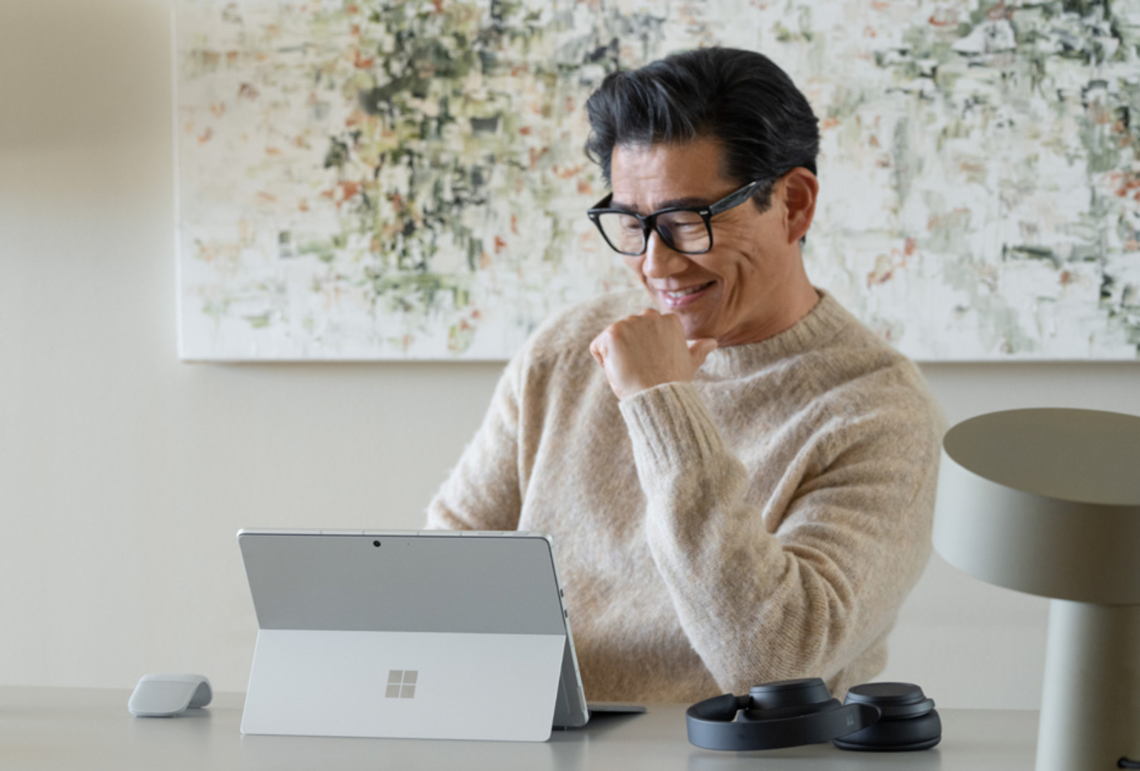 Man sitting at desk with Surface device