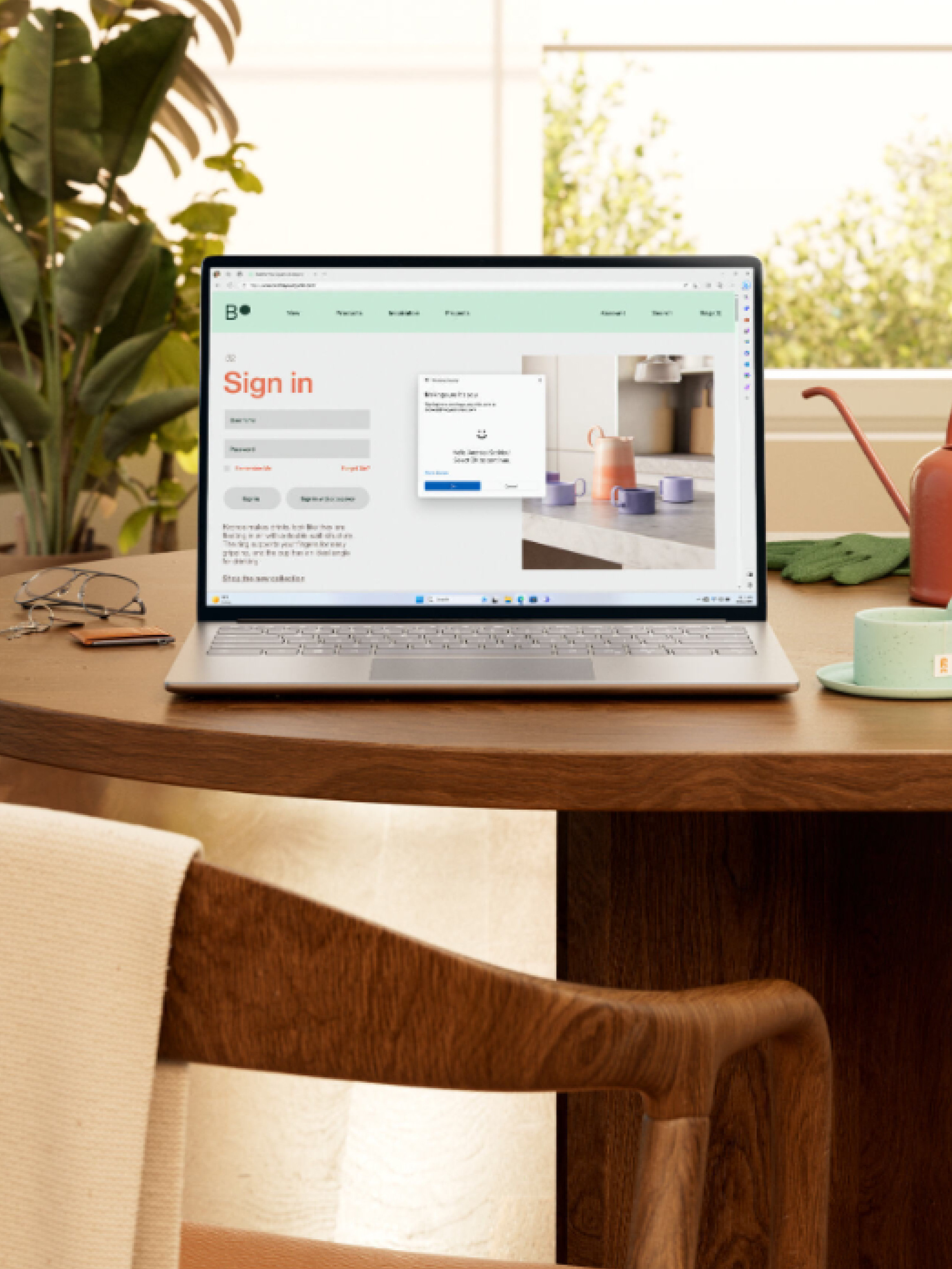 PC on a table, surrounded by personal items