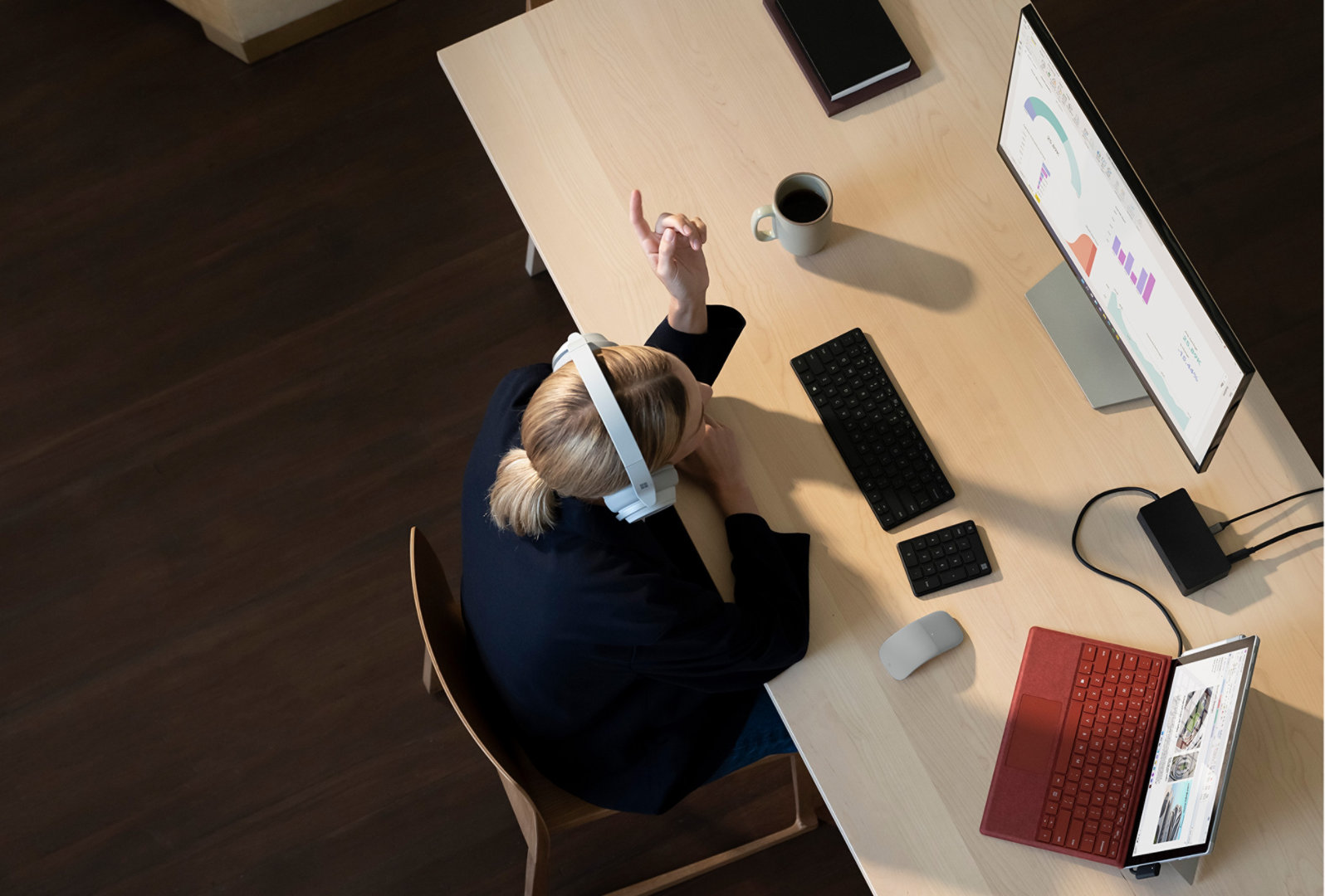 Surface Pro 7+ is shown on a home office desk while connected to an external monitor using multiple ports