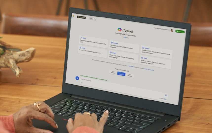 A person launching Copilot for Microsoft 365 in a laptop.