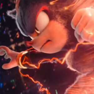 animated blue hedgehog reaching for something with a fiercely determined expression