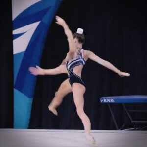 A still image from an AI-generated video of an ever-morphing synthetic gymnast.