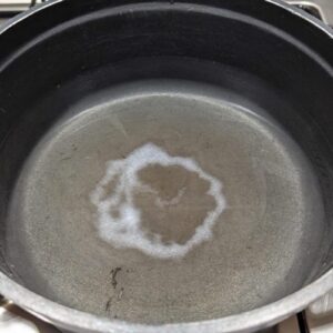 Releasing a handful of salt into a pasta pan can result in a circular ring deposit