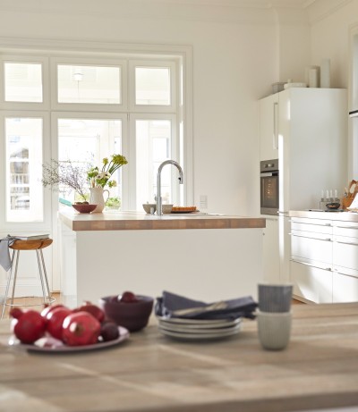 a white kitchen with an kitchen island