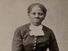 Photograph shows a full-length portrait of Harriet Tubman (1820?-1913) looking directly at the camera with folded hands resting on back of an upholstered chair. [Auburn, N.Y.] : [Harvey Lindsley], [taken between 1871 and 1876?, printed between 1895 and 1910]