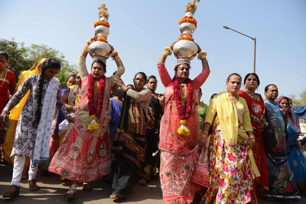 Indian hijras participate in a religious procession in Gandhinagar, India, some 30 kilometers from Ahmedabad, on March 22, 2017. Hijra is a term used in South Asia which refers to transgender individuals who are born male. (gender identity, gender expression)