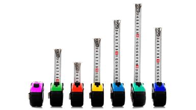 A photo of several measuring tapes of different colors.