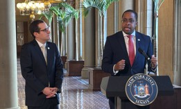 Assembly Member Micah Lasher looks on as state Sen. Zellnor Myrie discusses their proposed discovery reform bill.