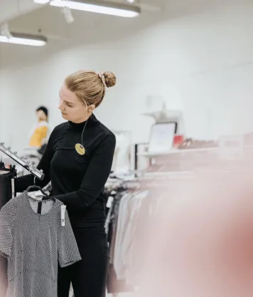 A person organising in a store 