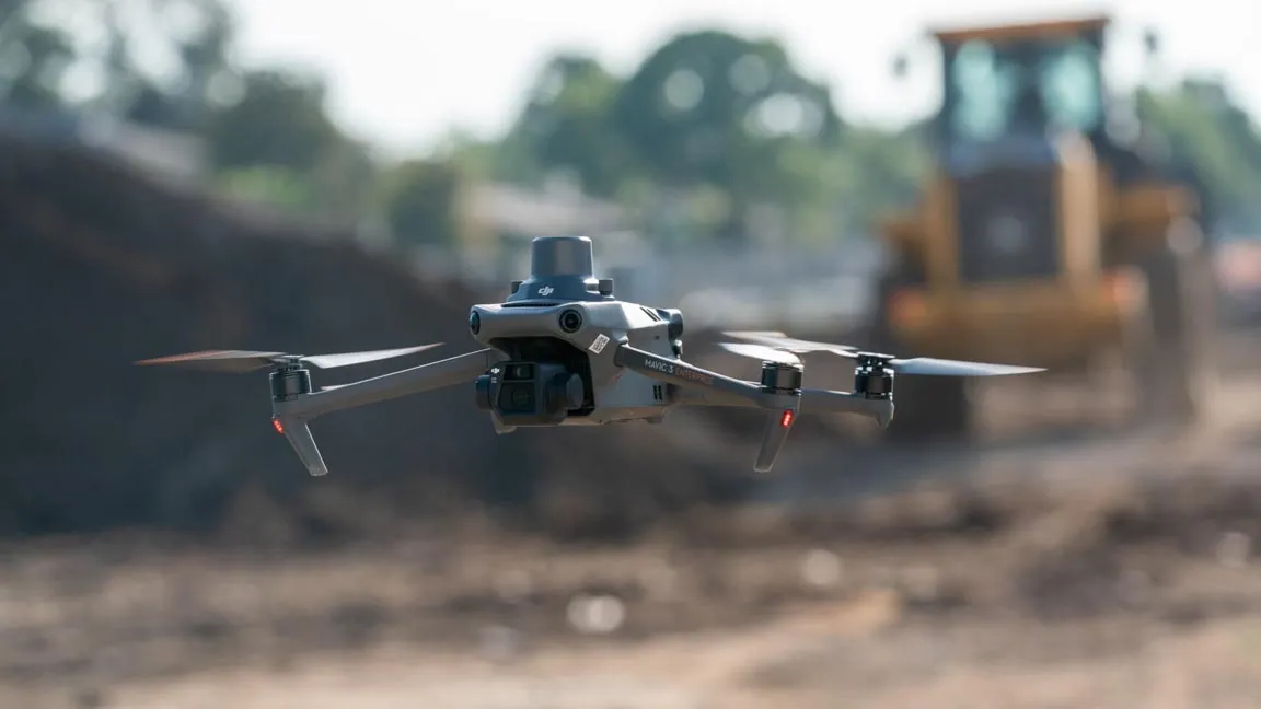 A drone in flight on a construction site