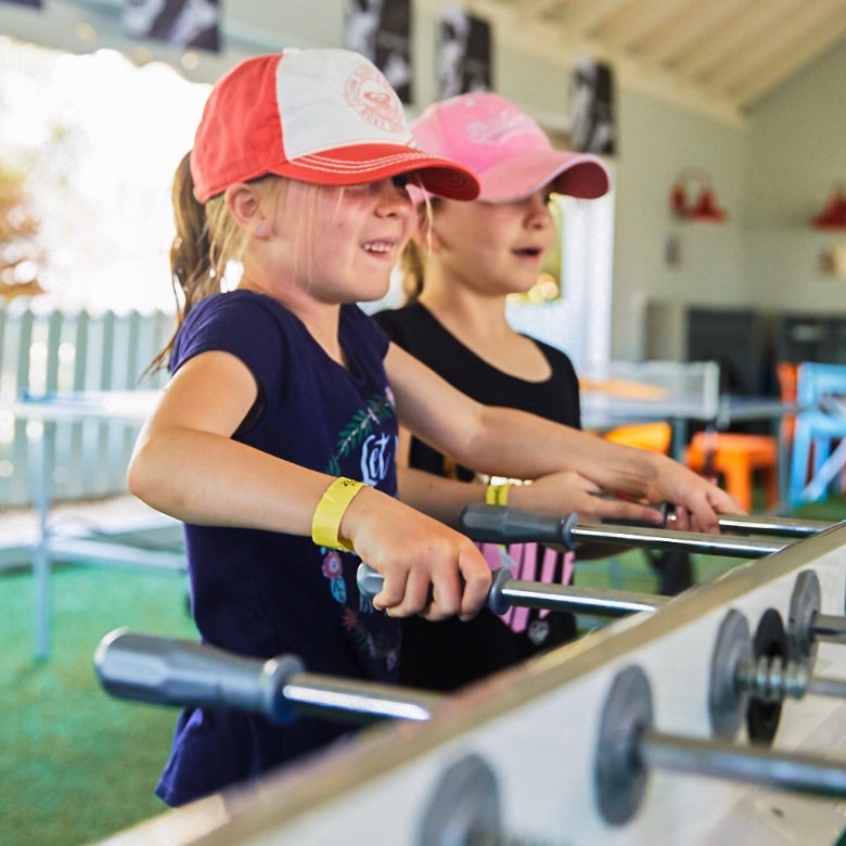 Children playing foosball