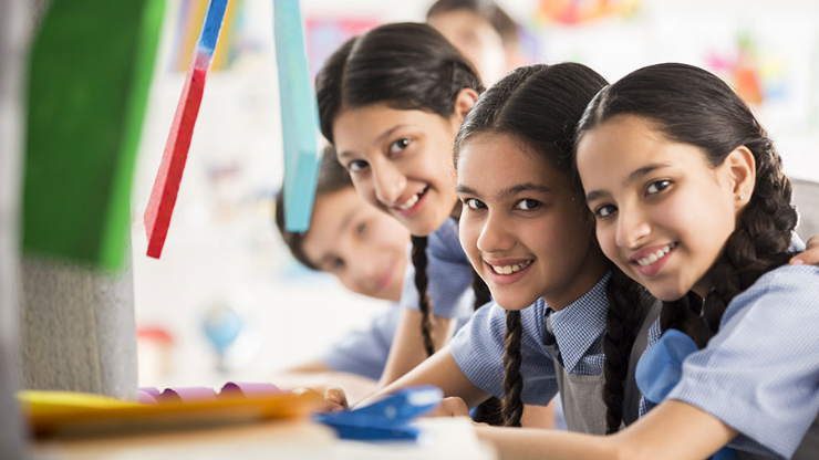 Campaign image of girls in a classroom