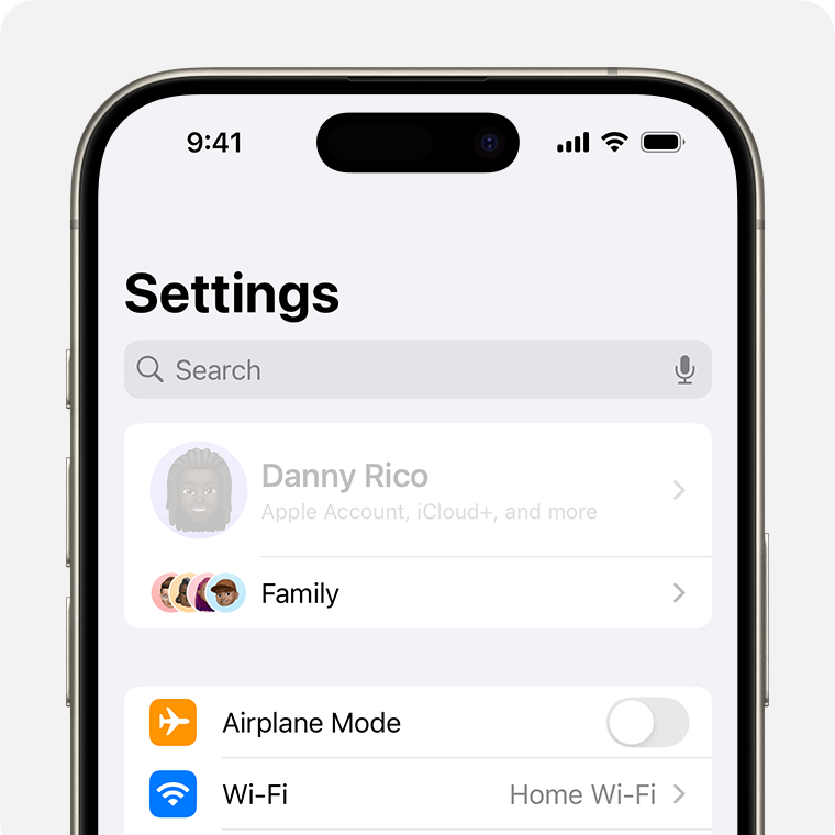 An iPhone showing the owner’s name greyed out at the top of Settings.