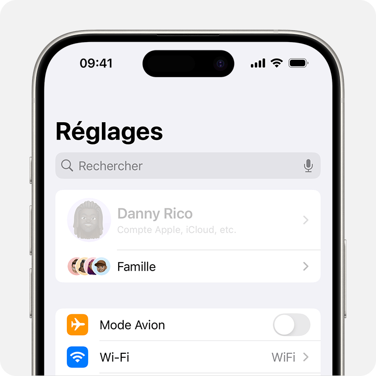 Un iPhone affichant le nom du propriétaire grisé en haut de Réglages.