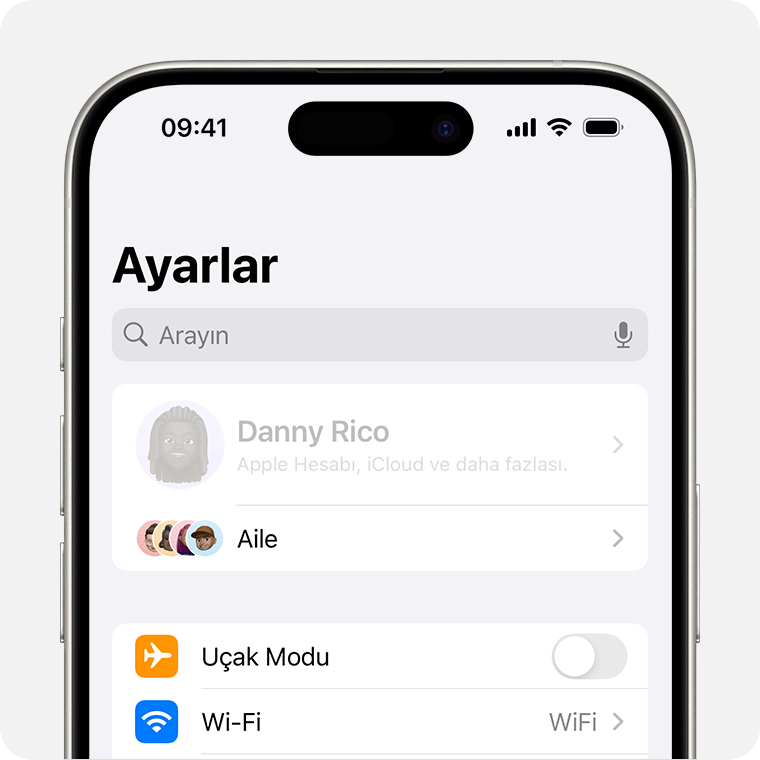 Ayarlar'ın üst kısmında sahibin adının gri renkte gösterildiği iPhone.