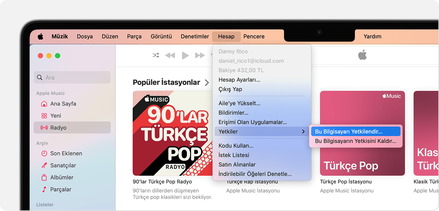 Mac'te Bu Bilgisayarı Yetkilendir ve Bu Bilgisayarın Yetkisini Kaldır seçeneklerinin gösterildiği Apple Music uygulaması