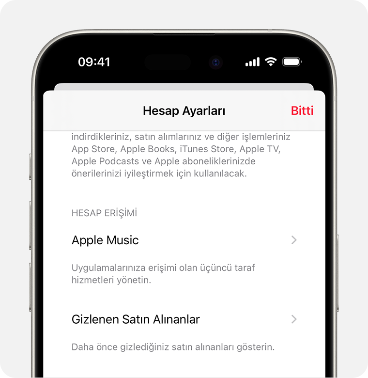 Apple Music uygulamasında Hesap Ayarları ekranının gösterildiği bir iPhone. Gizli Satın Alımlar, ekranın ortasında yer alıyor.