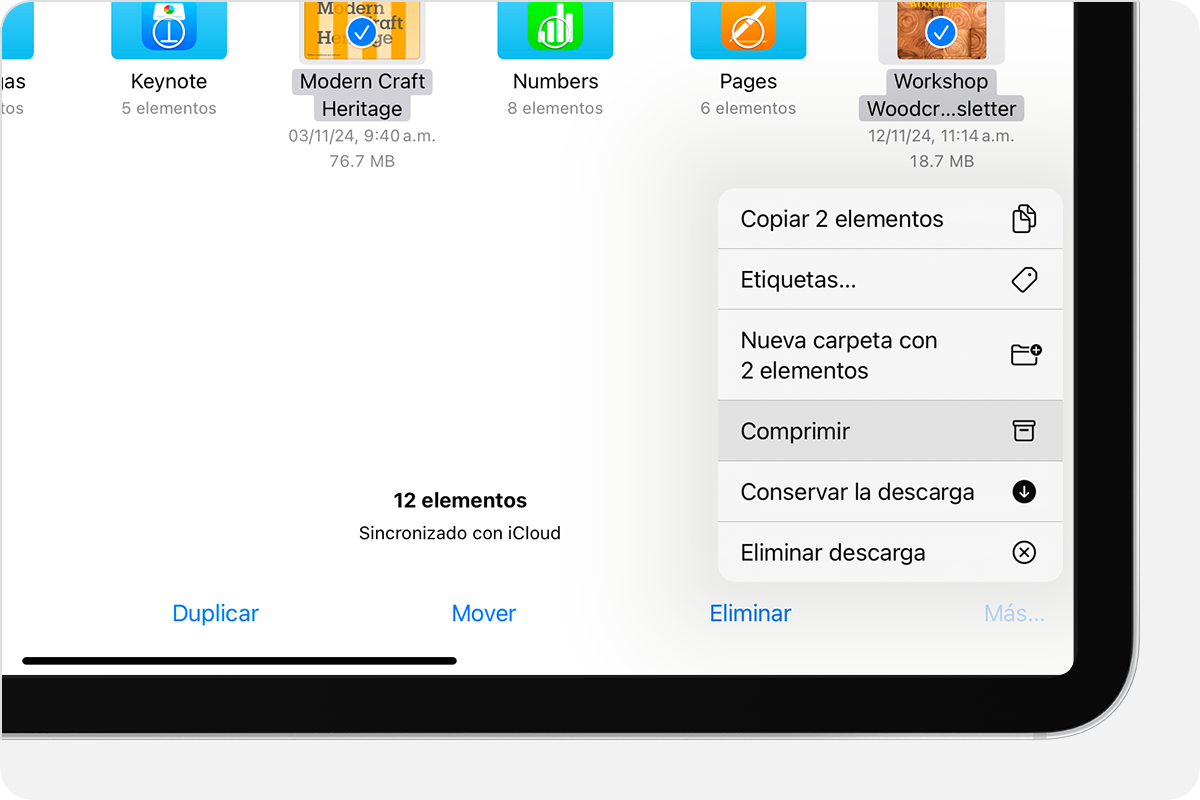 Las opciones que se muestran son Copy 2 Items (Copiar 2 elementos), Etiquetas, New Folder with 2 Items (Nueva carpeta con 2 elementos), Comprimir, Conservar la descarga y Remove Downloaded (Eliminar descarga).