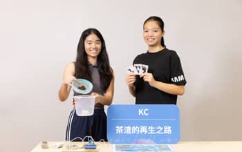 Two students holding their project products