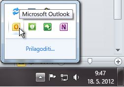 Notification area expanded to show the Outlook icon