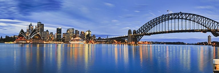 view of Sydney Opera House and Harbour Bridge at dusk