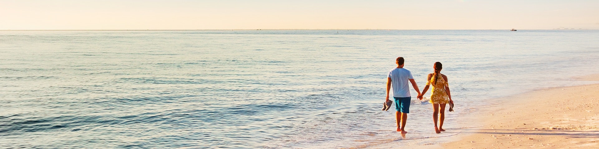 couple walking at sunset 