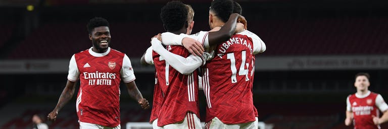 Arsenal FC players celebrating on field