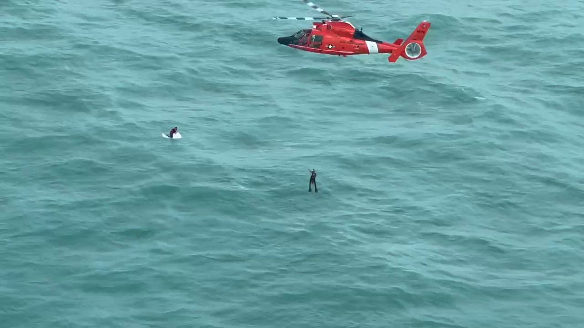 A Coast Guard Air Station Miami aircrew rescues a man clinging to a cooler approximately 30 miles off Longboat Key, Florida, Oct. 9th, 2024. The man was taken to Tampa General hospital for medical care after Coast Guard Sector St. Petersburg lost communications with the man at approximately 6:45 p.m. (U.S. Coast Guard video)