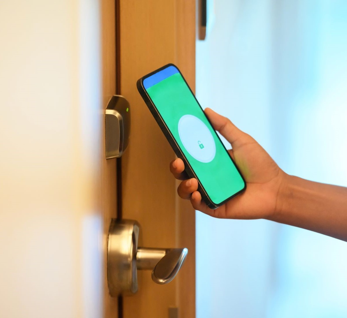 A person unlocking a door using a smartphone