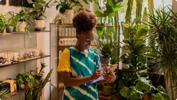 woman looking at smartphone home office