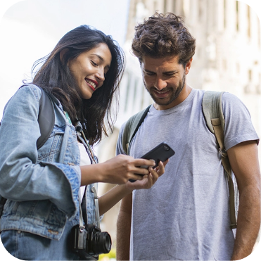 Young Couple Visiting City and Looking at Photos