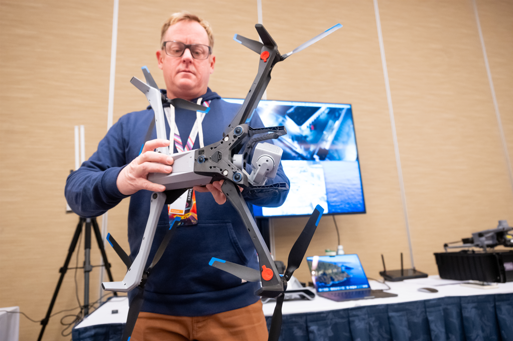 Figure 3: A security team member showcases a drone used to help secure re:Play