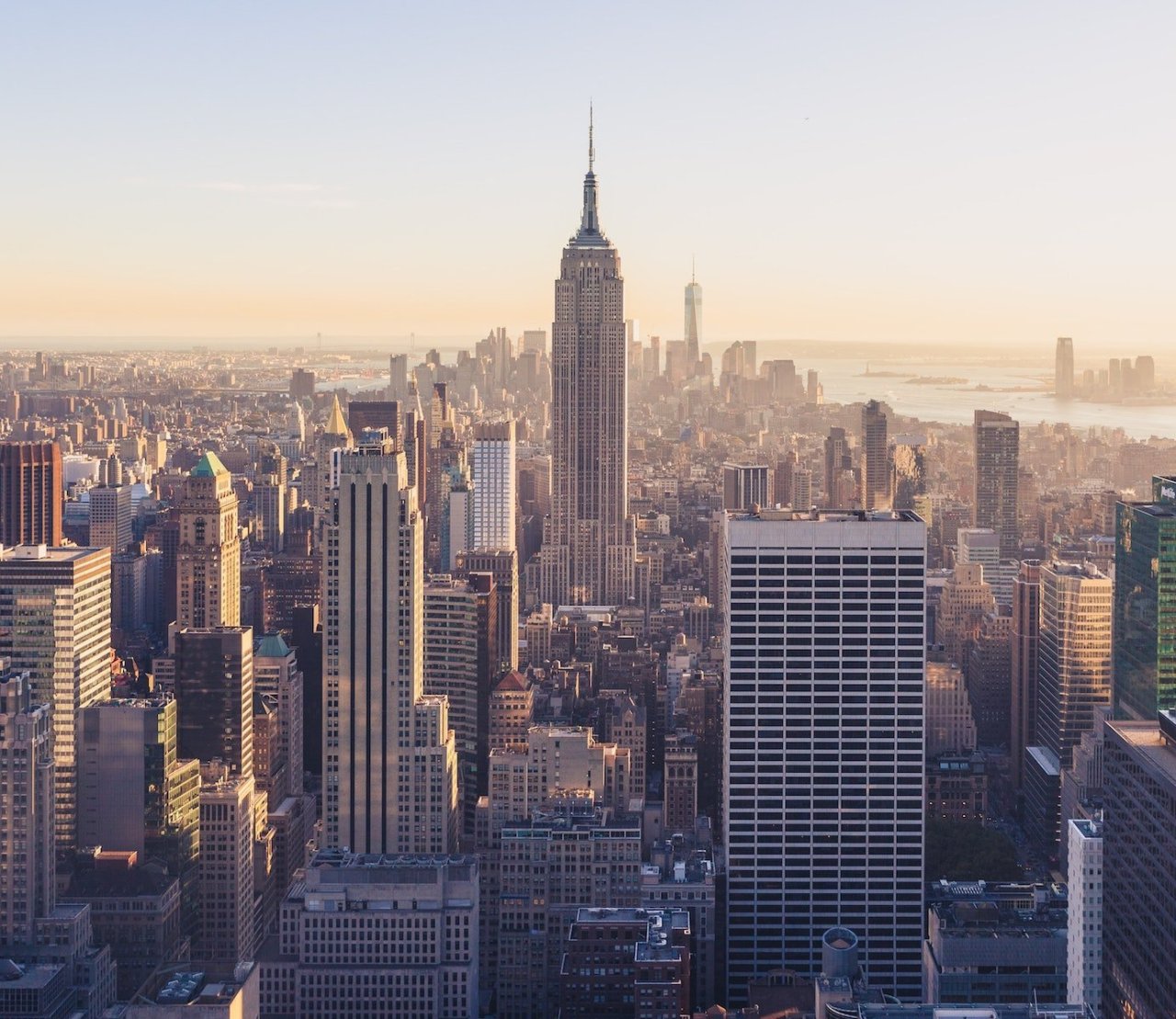 City skyline view of New York City, New York with a view of the Empire State Building.