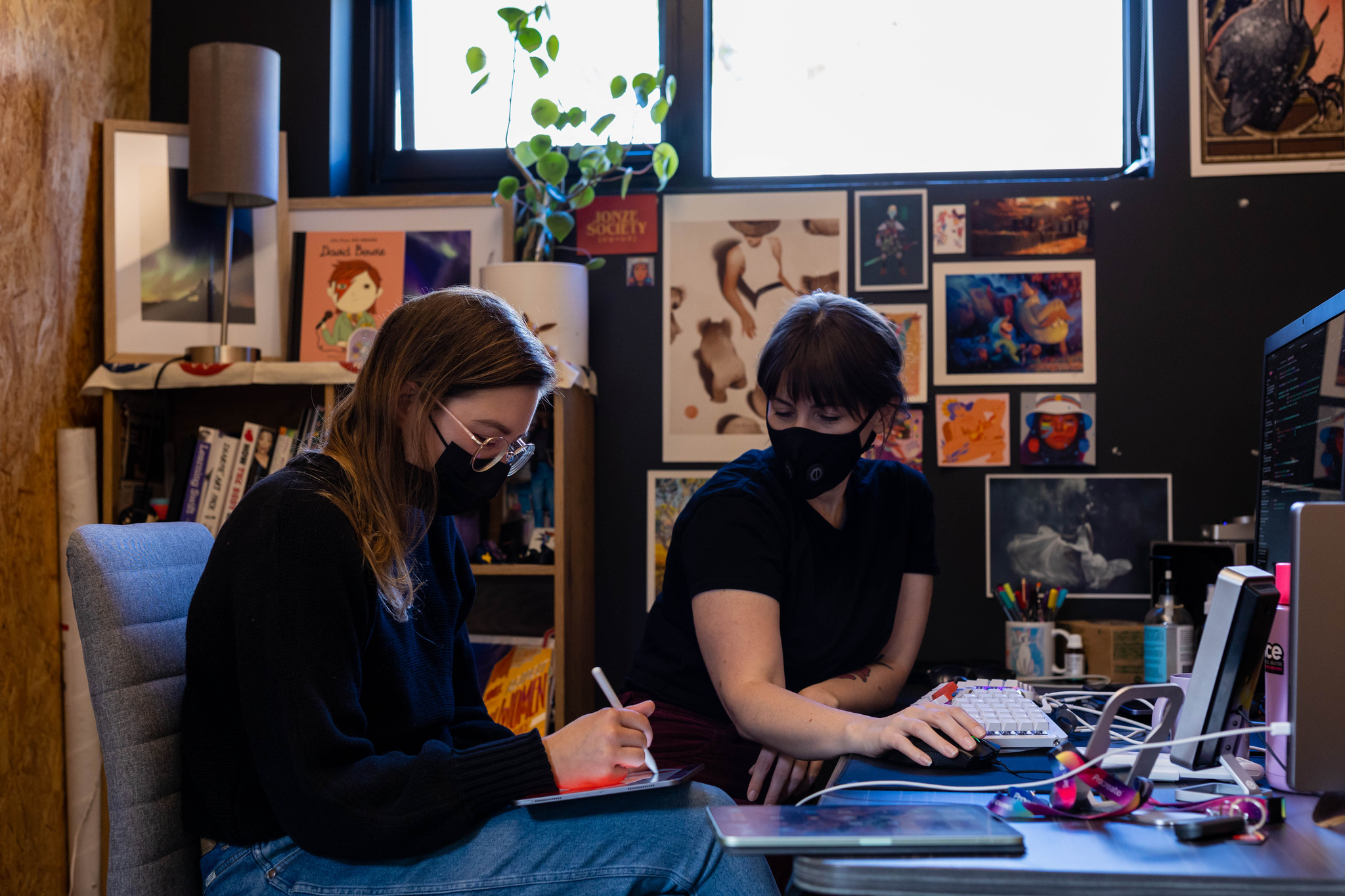 A photo of d’Este and a colleague in the office, surrounded by art.