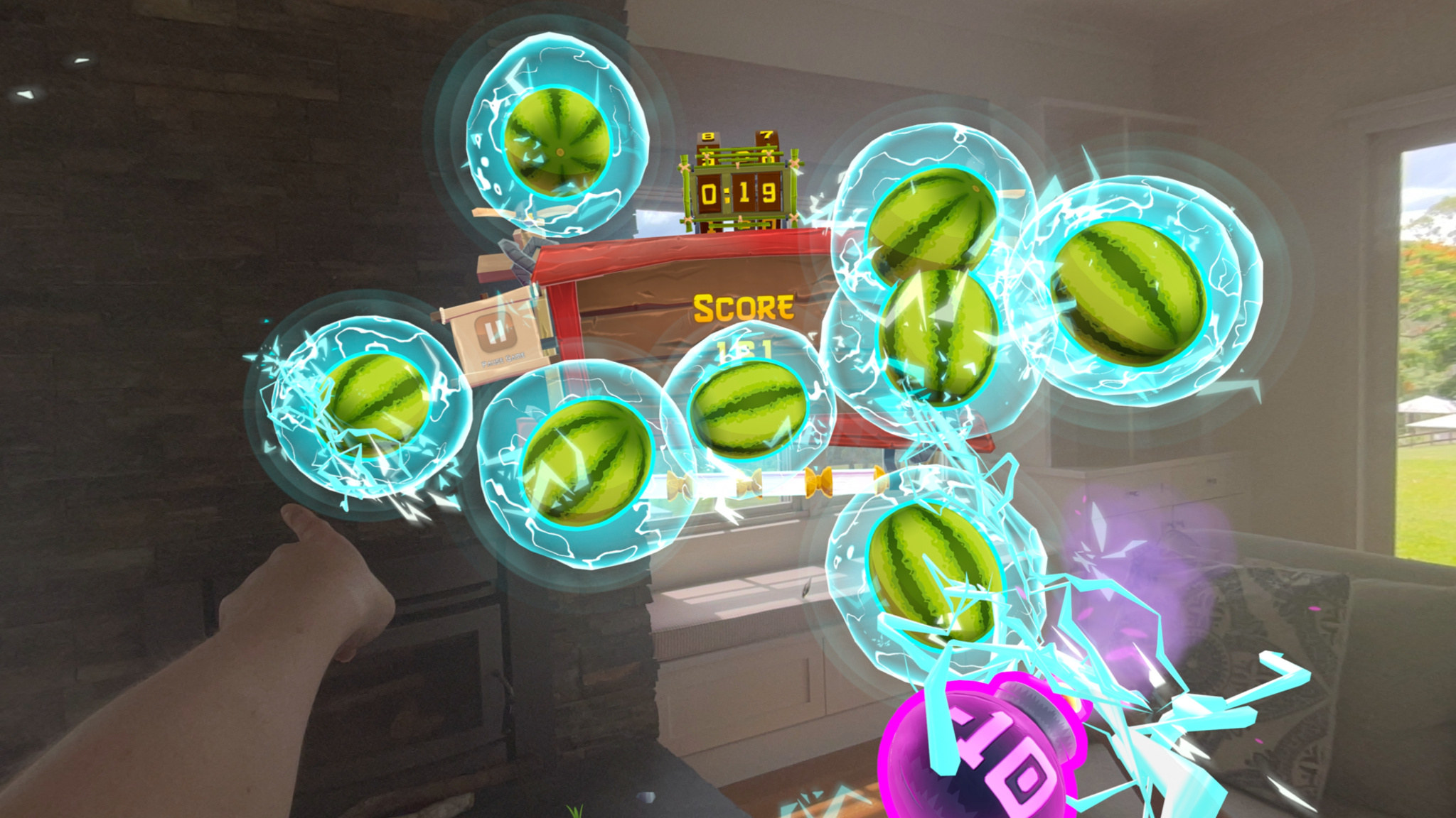 A player’s arm slices through a series of floating watermelons in a living room setting. In the background, a scoreboard hovers in front of a fireplace.