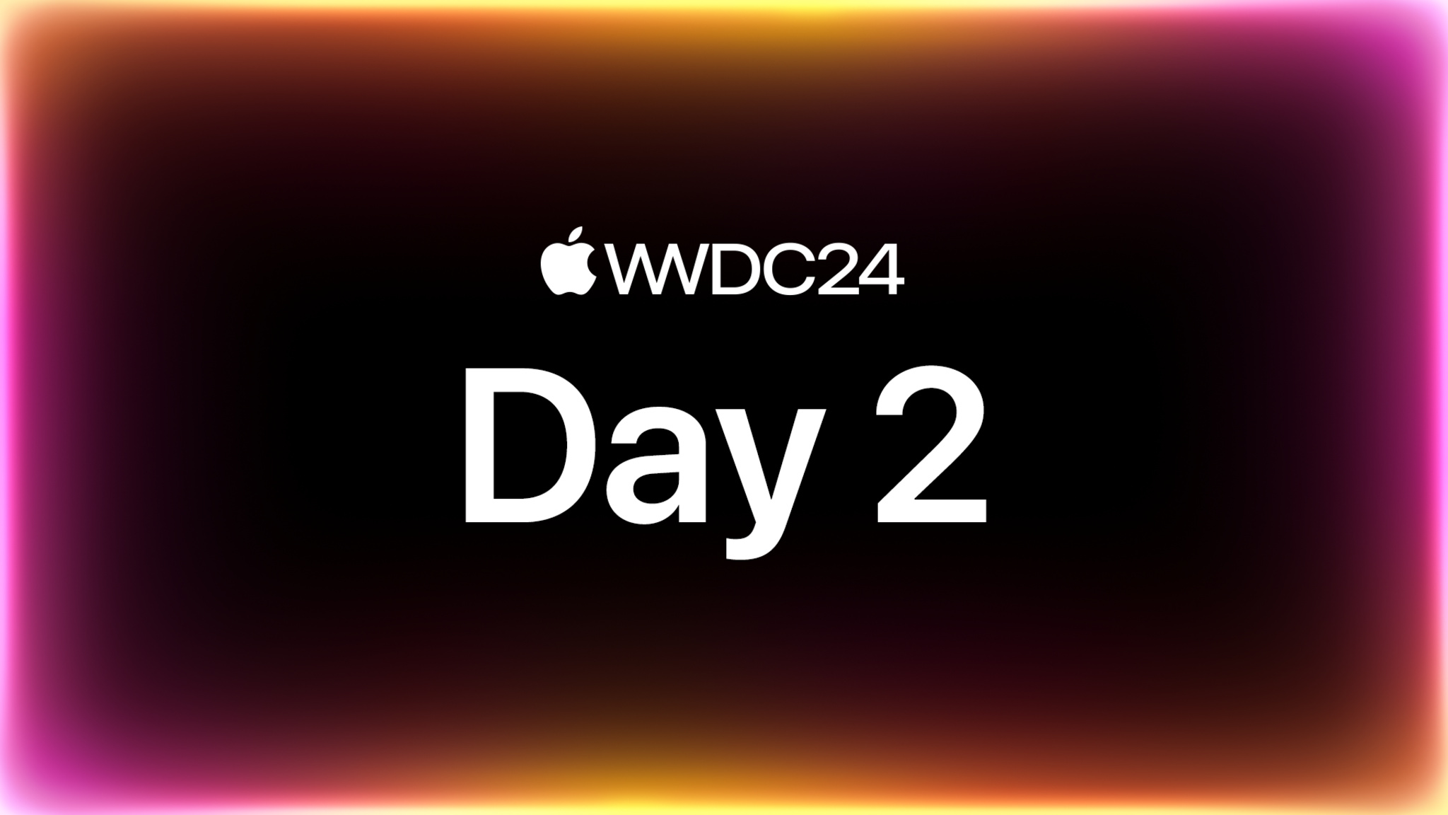 オレンジと紫の光で縁取られた黒い背景上に配置された「WWDC24 Day 2」のテキスト。