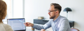 man showing client his computer screen