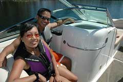 Couple wearing lifejackets on a boat