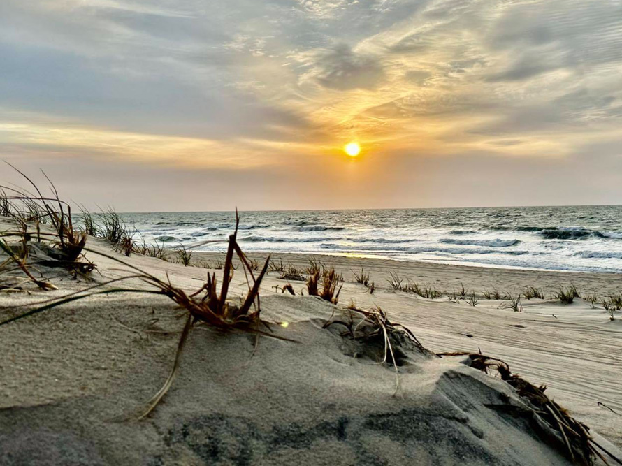 Sunrise from behind a dune