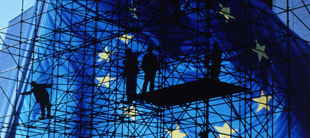 Scaffolding alongside building with European flag © EU