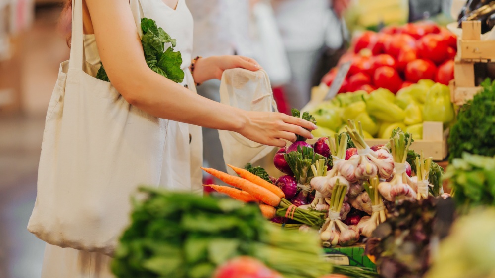 A person shopping for vegetables.